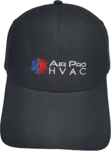 A black baseball cap featuring the embroidered “Air Pro HVAC” logo with a blue and red sunburst, perfect for any air conditioning repairman or anyone servicing air conditioning systems.